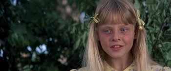 Movie still from “Tom Sawyer” (1973), directed by Don Taylor – A young girl with long blonde hair; Close Up shot, High angle