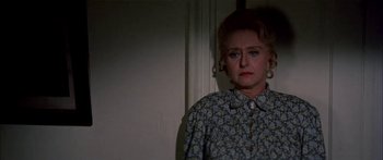 Movie still from “Tom Sawyer” (1973), directed by Don Taylor – An older woman standing in front of a wall; Close Up shot, Low angle