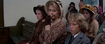 Movie still from “Tom Sawyer” (1973), directed by Don Taylor – An older woman in a brown dress and a little boy; Medium shot, Over the shoulder angle