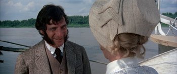 Movie still from “Tom Sawyer” (1973), directed by Don Taylor – A man and a woman are talking on a boat; Close Up shot, Over the shoulder angle