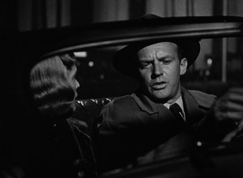 Movie still from “Too Late for Tears” (1949), directed by Byron Haskin – A man and a woman sitting in a car; Close Up shot, Over the shoulder angle