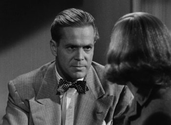 Movie still from “Too Late for Tears” (1949), directed by Byron Haskin – A black and white photo of a man and a woman; Close Up shot, Over the shoulder angle