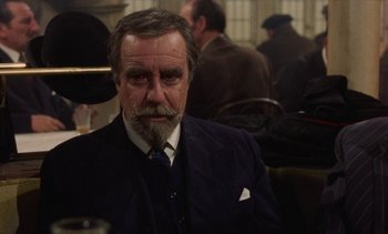 Movie still from “Tristana” (1970), directed by Luis Buñuel – An older man with a beard and a mustache; Close Up shot, Over the shoulder angle