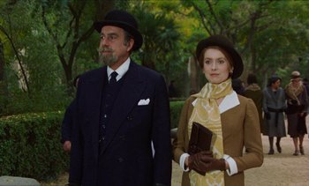 Movie still from “Tristana” (1970), directed by Luis Buñuel – A man and a woman dressed in vintage clothing; Medium shot, Low angle