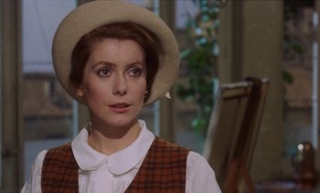 Movie still from “Tristana” (1970), directed by Luis Buñuel – A person wearing a hat; Close Up shot, Over the shoulder angle