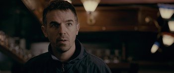 Movie still from “Wild Bill” (2011), directed by Dexter Fletcher – A person wearing a jacket; Close Up shot, Over the shoulder angle