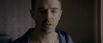 Movie still from “Wild Bill” (2011), directed by Dexter Fletcher – A person wearing a blue shirt; Close Up shot, Over the shoulder angle