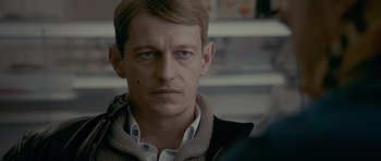 Movie still from “Wild Bill” (2011), directed by Dexter Fletcher – A person wearing a jacket; Close Up shot, Over the shoulder angle