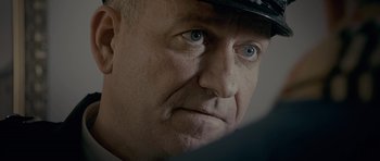 Movie still from “Wild Bill” (2011), directed by Dexter Fletcher – A person wearing a hat; Close Up shot, Over the shoulder angle