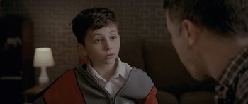 Movie still from “Wild Bill” (2011), directed by Dexter Fletcher – A young boy sitting in front of another boy; Close Up shot, Over the shoulder angle