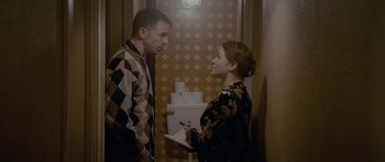 Movie still from “Wild Bill” (2011), directed by Dexter Fletcher – A man and a woman standing next to each other; Medium shot, Over the shoulder angle