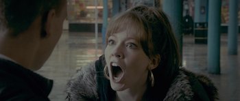 Movie still from “Wild Bill” (2011), directed by Dexter Fletcher – A woman with her mouth wide open with her tongue hanging out; Close Up shot, Low angle