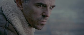 Movie still from “Wild Bill” (2011), directed by Dexter Fletcher – A man's face with a beard; Close Up shot, Low angle