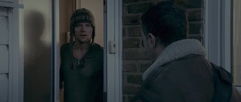 Movie still from “Wild Bill” (2011), directed by Dexter Fletcher – A man standing in front of a door looking in the mirror; Medium shot, Over the shoulder angle