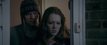 Movie still from “Wild Bill” (2011), directed by Dexter Fletcher – A man and a woman standing next to each other in a room; Close Up shot, Over the shoulder angle