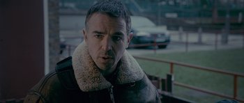 Movie still from “Wild Bill” (2011), directed by Dexter Fletcher – A person wearing a jacket; Close Up shot, Over the shoulder angle