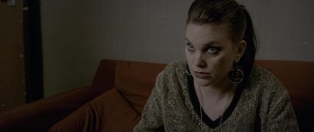 Movie still from “Wild Bill” (2011), directed by Dexter Fletcher – A person sitting on a couch; Close Up shot, Over the shoulder angle