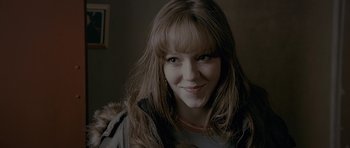 Movie still from “Wild Bill” (2011), directed by Dexter Fletcher – A person with long brown hair; Close Up shot, Over the shoulder angle