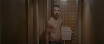 Movie still from “Wild Bill” (2011), directed by Dexter Fletcher – A young man standing in front of a bathroom mirror; Medium shot, High angle