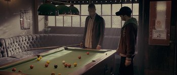 Movie still from “Wild Bill” (2011), directed by Dexter Fletcher – Two men are playing a game of billiards; Medium shot, High angle
