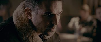 Movie still from “Wild Bill” (2011), directed by Dexter Fletcher – A person wearing a tie; Close Up shot, Over the shoulder angle