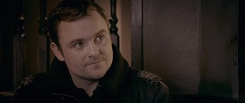 Movie still from “Wild Bill” (2011), directed by Dexter Fletcher – A person wearing a jacket; Close Up shot, Over the shoulder angle