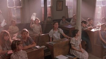 Movie still from “Wild Hearts Can't Be Broken” (1991), directed by Steve Miner – A group of people sitting in a room; Wide shot, High angle