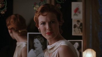 Movie still from “Wild Hearts Can't Be Broken” (1991), directed by Steve Miner – A person wearing a dress; Close Up shot, Over the shoulder angle