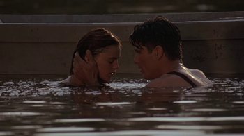 Movie still from “Wild Hearts Can't Be Broken” (1991), directed by Steve Miner – A man and a woman in the water; Medium shot, Low angle
