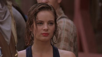 Movie still from “Wild Hearts Can't Be Broken” (1991), directed by Steve Miner – A person with wet hair; Close Up shot, Over the shoulder angle