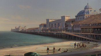Movie still from “Wild Hearts Can't Be Broken” (1991), directed by Steve Miner – A group of people standing on top of a sandy beach; Extreme Wide shot, High angle