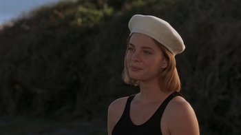 Movie still from “Wild Hearts Can't Be Broken” (1991), directed by Steve Miner – A woman wearing a white hat and a black tank top; Close Up shot, Low angle