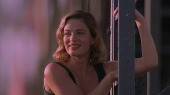 Movie still from “Wild Hearts Can't Be Broken” (1991), directed by Steve Miner – A woman with red lipstick leaning against a wall; Close Up shot, Low angle