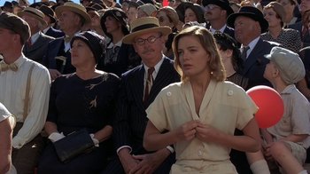 Movie still from “Wild Hearts Can't Be Broken” (1991), directed by Steve Miner – A crowd of people sitting and standing in a crowd; Medium shot, High angle