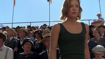 Movie still from “Wild Hearts Can't Be Broken” (1991), directed by Steve Miner – A crowd of people sitting in front of an audience; Medium shot, Low angle