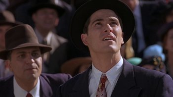 Movie still from “Wild Hearts Can't Be Broken” (1991), directed by Steve Miner – A man in a suit and a hat; Close Up shot, Low angle