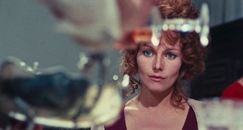 Movie still from “Your Vice Is a Locked Room and Only I Have the Key” (1972), directed by Sergio Martino – A person in a mirror; Close Up shot, Over the shoulder angle