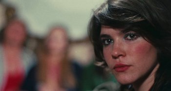 Movie still from “Your Vice Is a Locked Room and Only I Have the Key” (1972), directed by Sergio Martino – A woman's face in front of a blurry background; Close Up shot, Over the shoulder angle