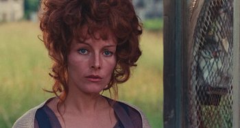 Movie still from “Your Vice Is a Locked Room and Only I Have the Key” (1972), directed by Sergio Martino – A person wearing a dress; Close Up shot, Over the shoulder angle