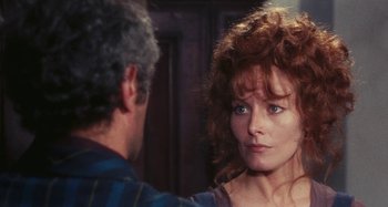 Movie still from “Your Vice Is a Locked Room and Only I Have the Key” (1972), directed by Sergio Martino – A man and a woman looking at each other in front of a mirror; Close Up shot, Over the shoulder angle