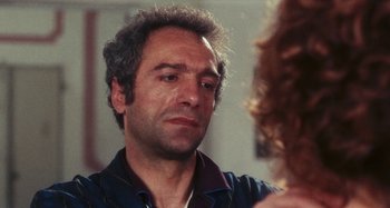 Movie still from “Your Vice Is a Locked Room and Only I Have the Key” (1972), directed by Sergio Martino – A person looking at a person in a mirror; Close Up shot, Over the shoulder angle