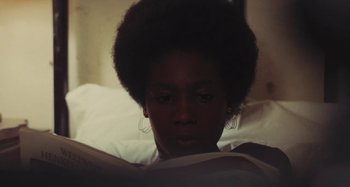 Movie still from “Your Vice Is a Locked Room and Only I Have the Key” (1972), directed by Sergio Martino – A woman is reading a book in the dark; Close Up shot, High angle