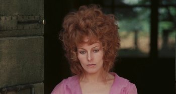 Movie still from “Your Vice Is a Locked Room and Only I Have the Key” (1972), directed by Sergio Martino – A person wearing a pink shirt; Close Up shot, Low angle