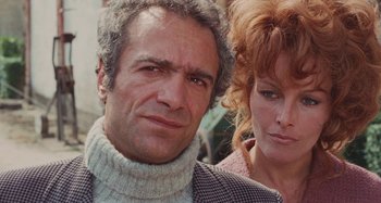 Movie still from “Your Vice Is a Locked Room and Only I Have the Key” (1972), directed by Sergio Martino – A man and a woman standing next to each other; Close Up shot, High angle