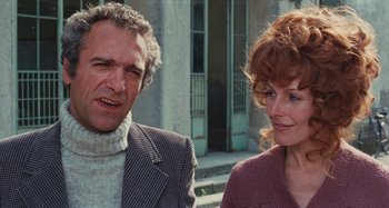 Movie still from “Your Vice Is a Locked Room and Only I Have the Key” (1972), directed by Sergio Martino – A man and a woman standing next to each other; Close Up shot, Low angle