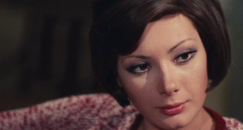 Movie still from “Your Vice Is a Locked Room and Only I Have the Key” (1972), directed by Sergio Martino – A woman's face in a sweater; Close Up shot, High angle