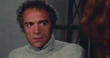 Movie still from “Your Vice Is a Locked Room and Only I Have the Key” (1972), directed by Sergio Martino – A person wearing a sweater; Close Up shot, Low angle