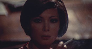 Movie still from “Your Vice Is a Locked Room and Only I Have the Key” (1972), directed by Sergio Martino – A person with short brown hair; Close Up shot, High angle