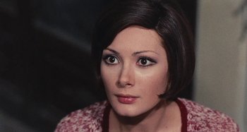Movie still from “Your Vice Is a Locked Room and Only I Have the Key” (1972), directed by Sergio Martino – A person with short black hair; Close Up shot, High angle