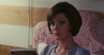 Movie still from “Your Vice Is a Locked Room and Only I Have the Key” (1972), directed by Sergio Martino – A person sitting in a chair; Close Up shot, Over the shoulder angle